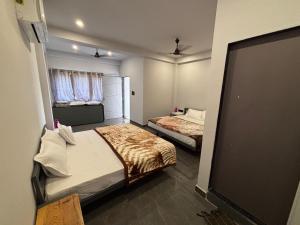 Postel nebo postele na pokoji v ubytování Unity homestay