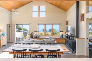 a living room with a table and chairs at Sea Pebble - Sea Ranch Retreat in Sea Ranch