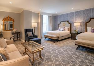 a hotel room with two beds and a couch at Willard InterContinental Washington by IHG in Washington +286 photos