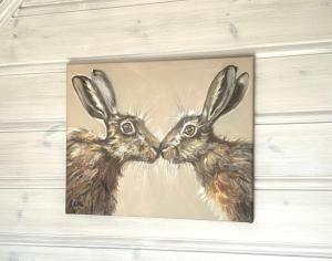 a painting of two bunnies next to each other at Ferienhaus HarzHase in Harzgerode