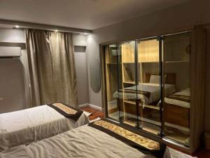 Postel nebo postele na pokoji v ubytování المهندسين شقه سوبر لوكس - محى الدين ابو العز