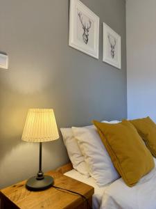 Posteľ alebo postele v izbe v ubytovaní Maya Pokoje i Apartamenty