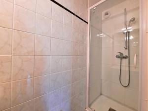 a shower with a glass door in a bathroom at Appartement 6 personnes aux pieds des pistes, animaux admis - FR-1-452-4 in Les Menuires