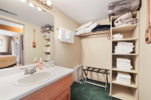 a bathroom with a sink and a mirror at Tahoe Keys Marina View - 3 BDR Desirable Community in South Lake Tahoe