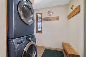 a laundry room with a washer and dryer at Tahoe Keys Marina View - 3 BDR Desirable Community in South Lake Tahoe