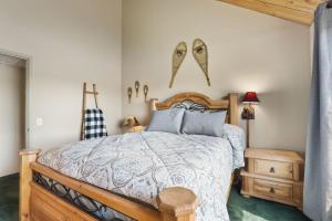a bedroom with a wooden bed and some shoes on the wall at Tahoe Keys Marina View - 3 BDR Desirable Community in South Lake Tahoe