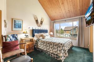 a bedroom with a bed and a window at Tahoe Keys Marina View - 3 BDR Desirable Community in South Lake Tahoe