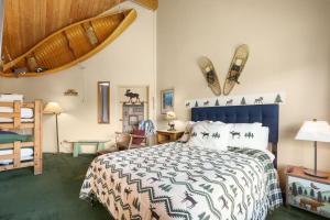 a bedroom with a bed and a wooden ceiling at Tahoe Keys Marina View - 3 BDR Desirable Community in South Lake Tahoe