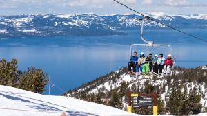 a group of people sitting on a ski lift at Tahoe Keys Marina View - 3 BDR Desirable Community in South Lake Tahoe