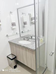 a bathroom with a sink and a mirror at Espacio Confortable y Agradable, Atlantis in Santa Cruz de la Sierra +30 photos