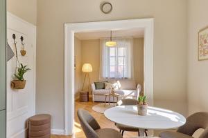 a living room with a table and chairs at Neu!!! Moselbleibe Altes Forsthaus in Bernkastel-Kues