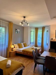 Posteľ alebo postele v izbe v ubytovaní Maya Pokoje i Apartamenty