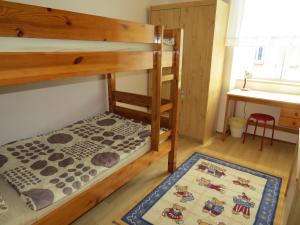 a bunk bed in a room with a rug at Apartment Stoja in Pula