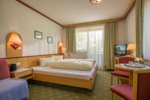Postel nebo postele na pokoji v ubytování Pension Garni Appartement Ortner