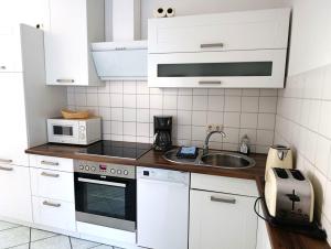 Køkken eller tekøkken på Fewo Rosenhof TW 110