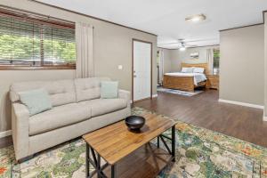 a living room with a couch and a table at Modern Rustic Family Home in Westlake La in Westlake +5 photos