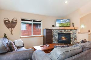 a living room with two couches and a fireplace at Kings Beach Bliss Walk to Outdoor Fun in Kings Beach