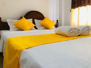 Postel nebo postele na pokoji v ubytování Grand Infinite Home Stay