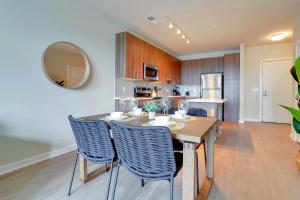 a kitchen and dining room with a table and chairs at Exquisite One-Bedroom Apartment in Alexandria in Alexandria