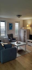 a living room with a couch and a coffee table at Ferienwohnung Tegge in Welzin