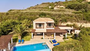 an aerial view of a house with a swimming pool at Villa Penelope Spartia Kefalonia in Spartià