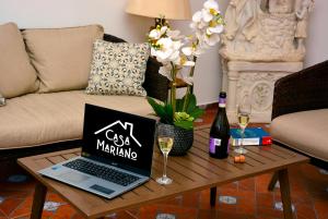 a coffee table with a laptop on top of it at Casa Angel in Morelia