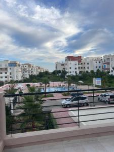 a view of a parking lot with cars and buildings at Tangier Beach Front in Tangier