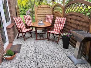 Patio nebo venkovní prostory v ubytování Ferienhaus in Dornumersiel 20-033
