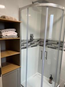 a shower with a glass enclosure in a bathroom at Seaside Cottage Retreat in Peterhead in Peterhead