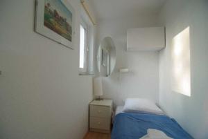 Ein Bett oder Betten in einem Zimmer der Unterkunft Villa Strandperle, Whg. 10
