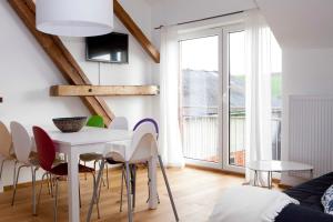 TV a/nebo společenská místnost v ubytování Ferienwohnungen Elsbacher Hof