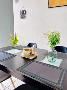 a black table with a plate of food on it at Casa Familiar in San Miguel