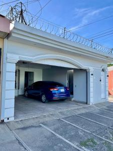 a car parked inside of a garage at Casa Familiar in San Miguel