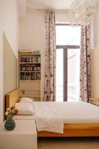 Postel nebo postele na pokoji v ubytování Villeni Panorama Apartment Oktonia