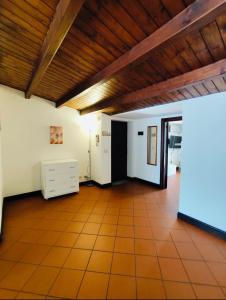 an empty living room with a wooden ceiling at Terrazze al centro in Palermo +52 photos