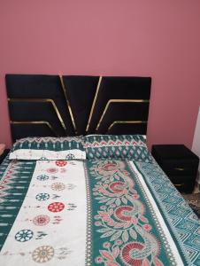 Voodi või voodid majutusasutuse Glamour Appartement toas