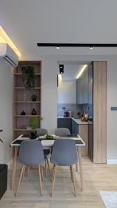 a kitchen and dining room with a table and chairs at The Central Spot, Mostar in Mostar