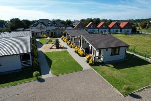 an overhead view of a residential neighborhood with houses at Domki Niezapominajka Ustka in Ustka