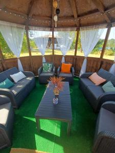 a living room with blue couches and a table at Vintage House in Elena