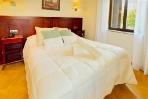 En eller flere senge i et værelse på Punta me Hotel