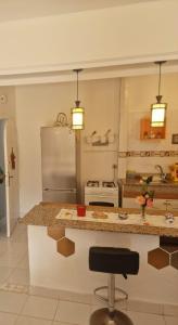 a kitchen with a counter and a refrigerator at Apartment 3 in Tangier +7 photos