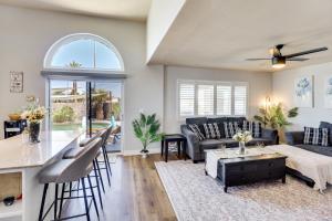 a living room with a couch and a table at Outdoor Entertaining Space Family Henderson Home in Las Vegas