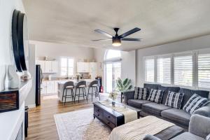 a living room with a couch and a ceiling fan at Outdoor Entertaining Space Family Henderson Home in Las Vegas