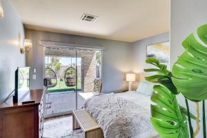 a bedroom with a bed and a sliding glass door at Outdoor Entertaining Space Family Henderson Home in Las Vegas +26 photos