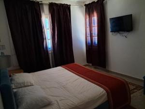 Postel nebo postele na pokoji v ubytování Dar Salem