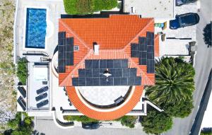 an overhead view of an orange roof with solar panels at Amazing Home In Crikvenica With Wifi in Crikvenica +43 photos