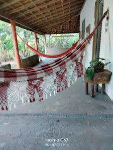 a hammock hanging from the side of a building at Paraíso dás águas in Botelhos +20 photos