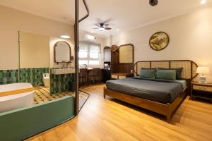 Ένα ή περισσότερα κρεβάτια σε δωμάτιο στο Ann Concept - Self service Homestay