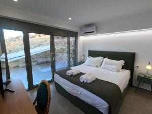 Ένα ή περισσότερα κρεβάτια σε δωμάτιο στο Prime Views +94 φωτογραφίες