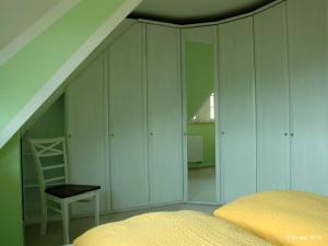 Ein Bett oder Betten in einem Zimmer der Unterkunft Landhaus Uhlenhof 4